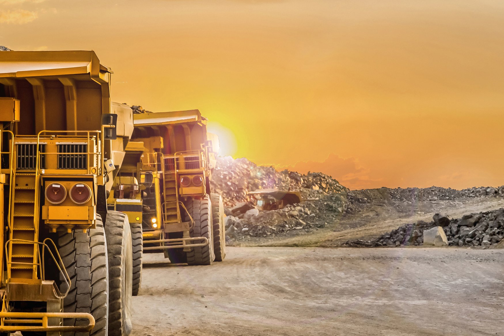 Trucks Riding into a Platinum Mining Site 